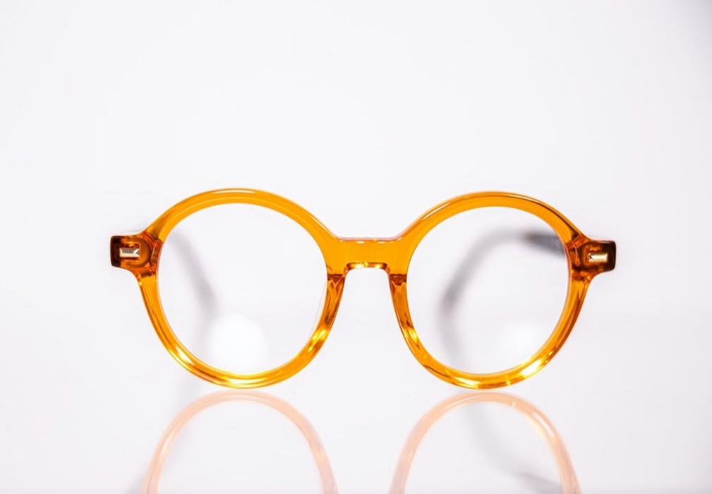 Orange round acetate prescription ready eyeglasses with Medium nose bridge, low nose bridge fit and High cheek bones fit
