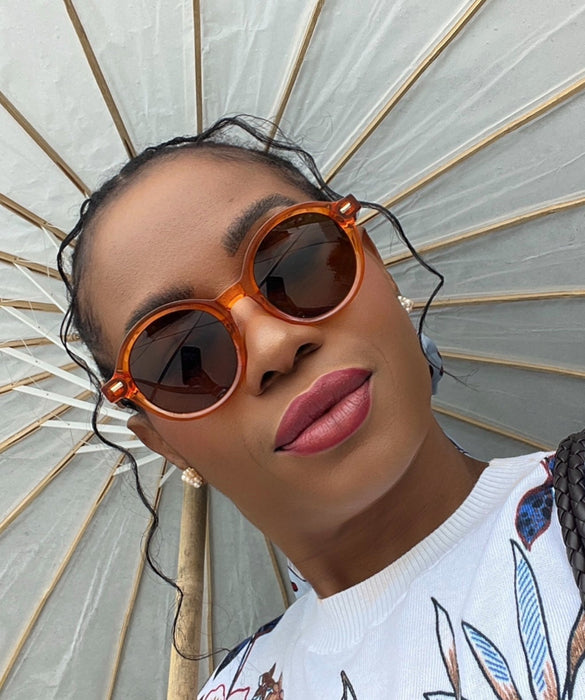 Orange round acetate sunglasses with Medium nose bridge bridge height fit and High cheek bones fit
